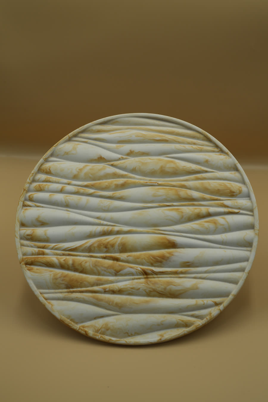 Round platter carved with flowing dune lines