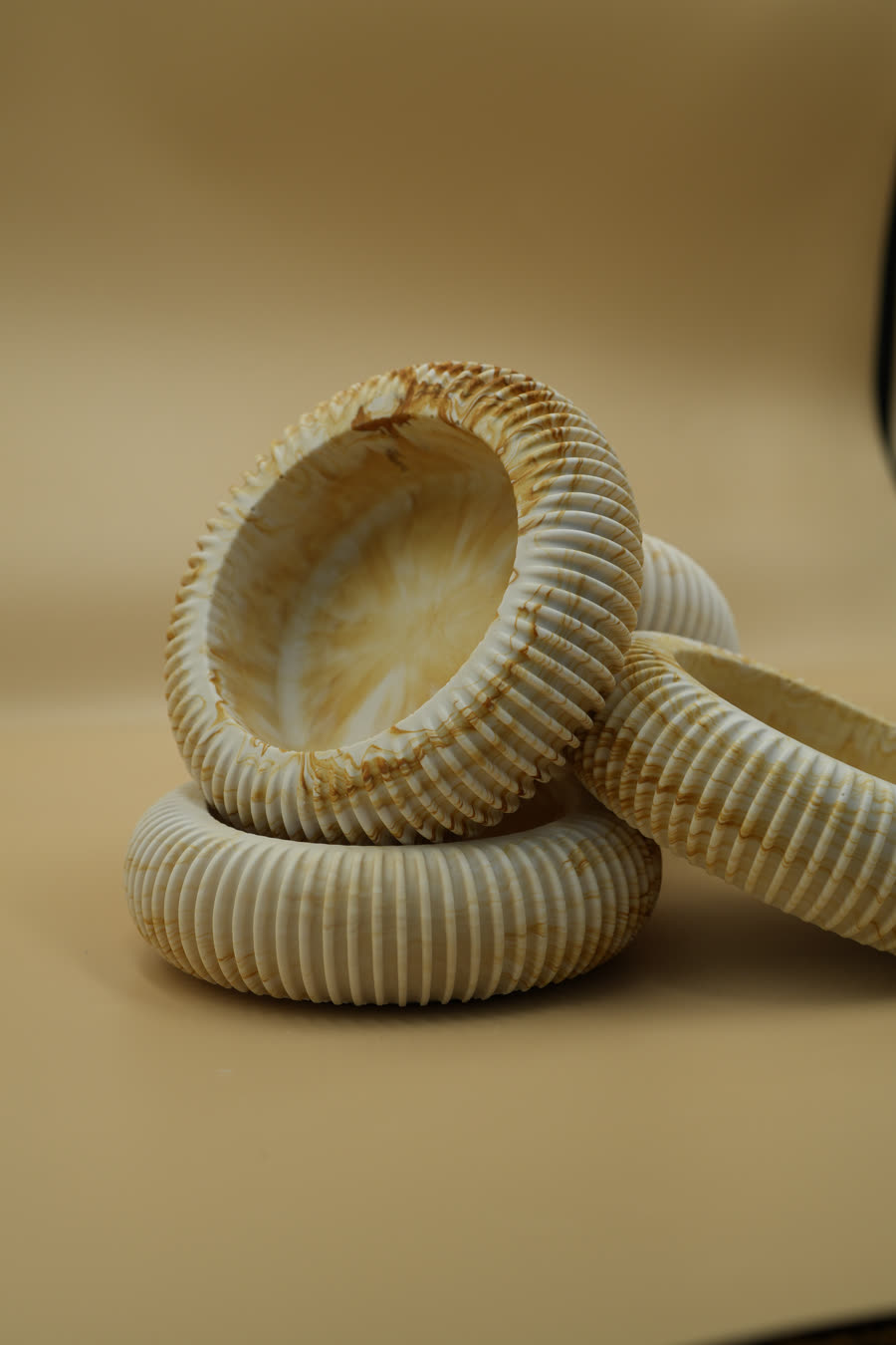 Ribbed bowls in Heartwood leaning together