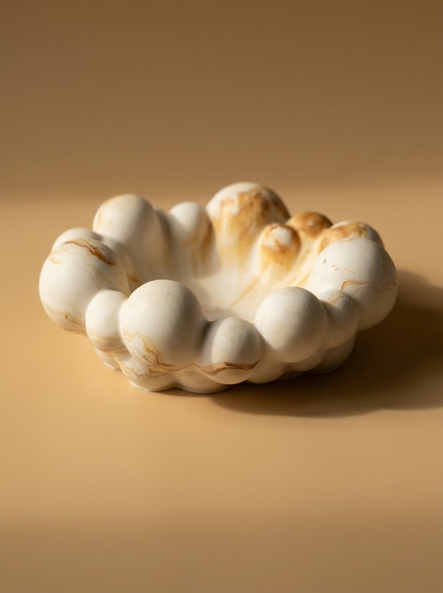 Small bowl with a rounded, shell-like scalloped rim